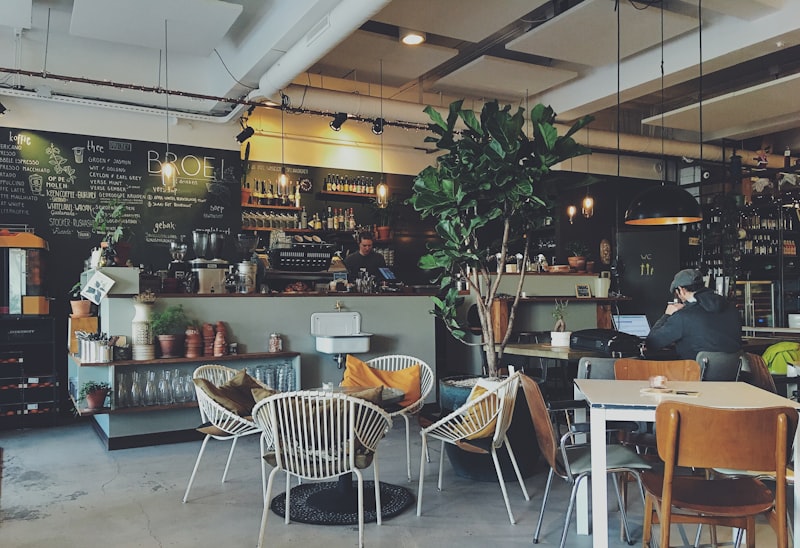 Warm rustic café interior with wooden tables and warm ambient lighting